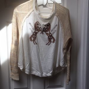 Long sleeve t shirt with knitted see thru sleeve.